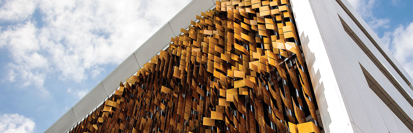 building with gold art on the side