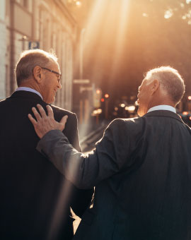 two business men walking together