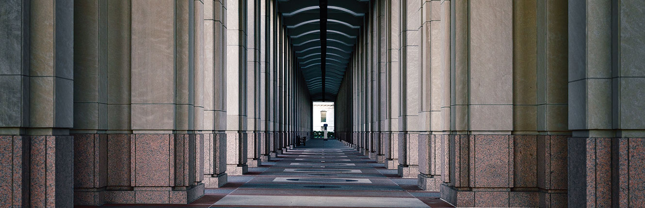 outside view of a long hall down a marble building